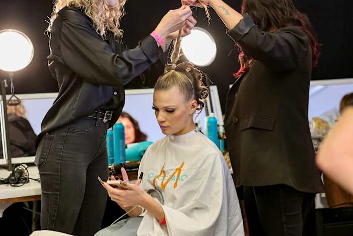 A model prepares backstage for The Blonds fashion show during September 2022 New York Fashion Week: The Shows at Gallery at Spring Studios on September 14, 2022 in New York City.